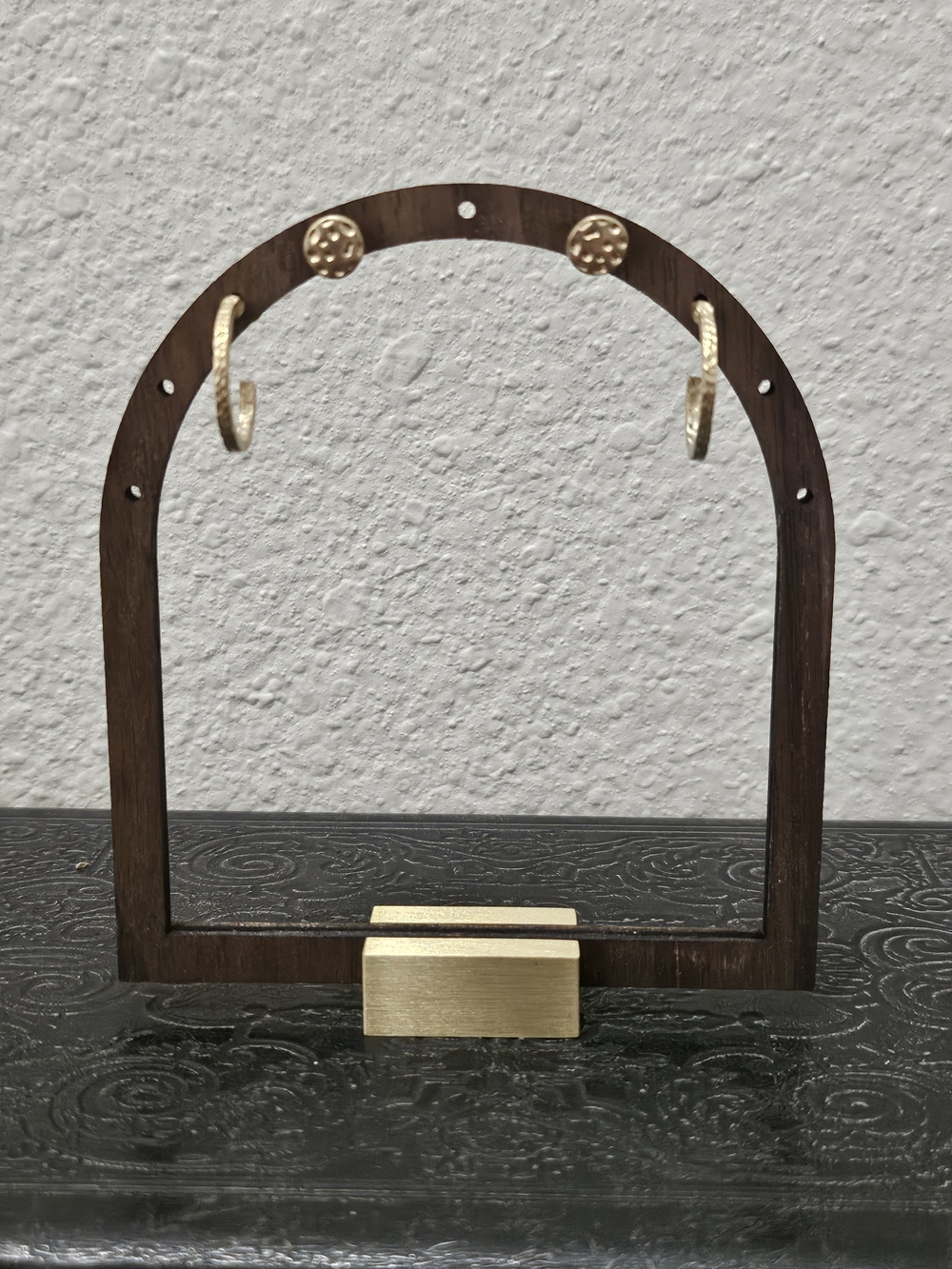 Gold Hoop Earrings on Dark Brown Wood Display - Elegant Women’s Earrings